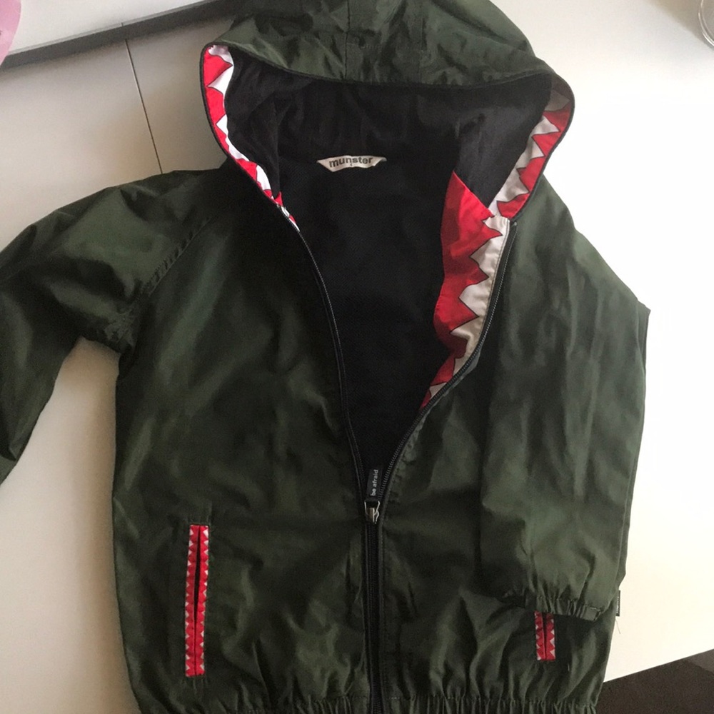 Munster Green Raincoat with Red Accents